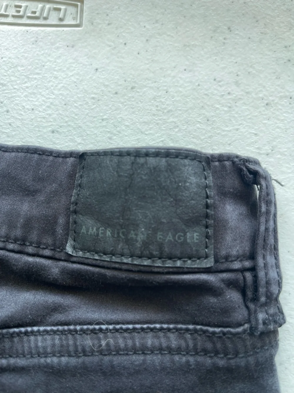 American Eagle Next Level Skinny Jeans Women’s 0 Short Black Mid Rise Stretch